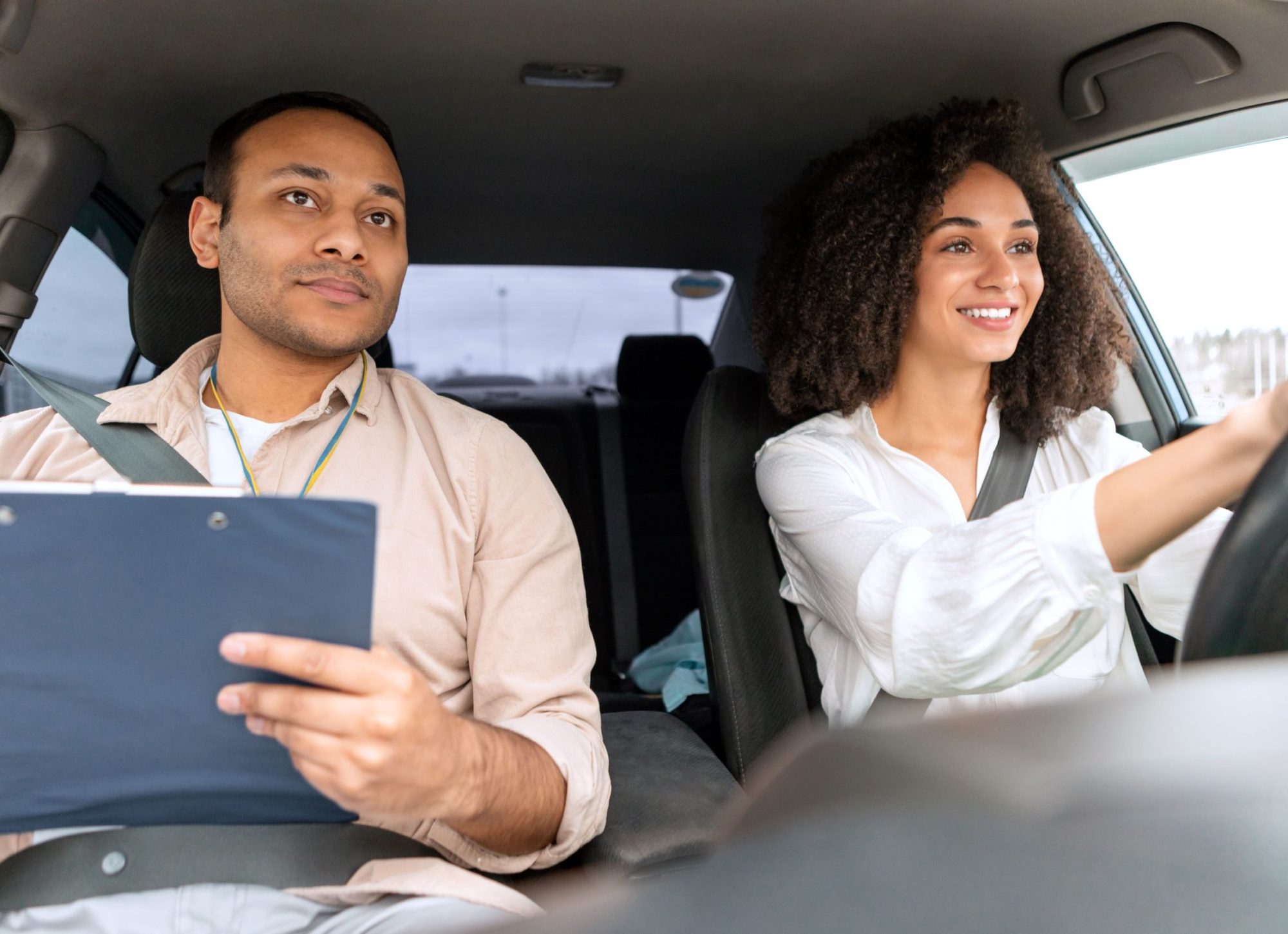 driving-instructor-man-teaching-novice-driver-woma-2026-03-24-02-25-27-utc