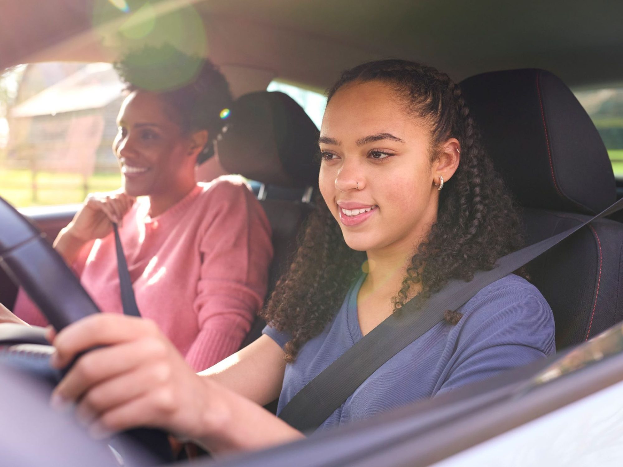 teenage-girl-in-car-having-driving-lesson-from-fem-2026-03-10-03-15-49-utc